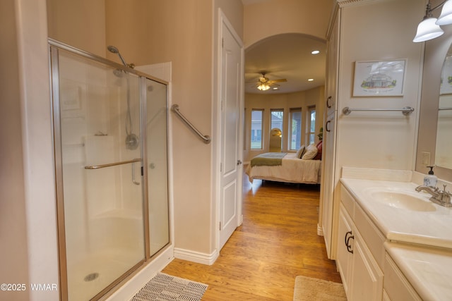 7444 Caldwell Canyon Rd, Snowflake, AZ 85937 - ensuite bathroom featuring a shower stall, wood finished floors, vanity, ceiling fan, and recessed lighting