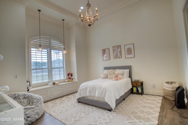 7444 Caldwell Canyon Rd, Snowflake, AZ 85937 - bedroom with a chandelier, light wood-type flooring, crown molding, and baseboards