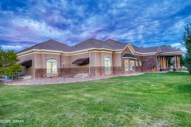 7444 Caldwell Canyon Rd, Snowflake, AZ 85937 - view of front of home with stone siding, stucco siding, and a lawn