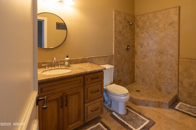 7444 Caldwell Canyon Rd, Snowflake, AZ 85937 - bathroom with tiled shower, vanity, toilet, and tile patterned floors