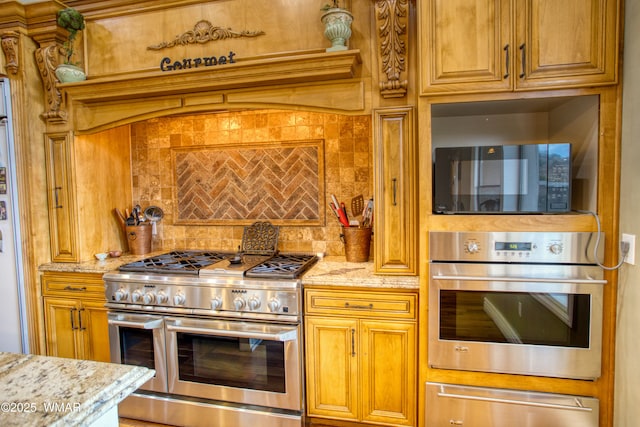 7444 Caldwell Canyon Rd, Snowflake, AZ 85937 - kitchen with appliances with stainless steel finishes, a warming drawer, decorative backsplash, and light stone countertops