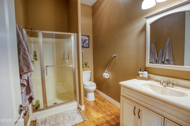 7444 Caldwell Canyon Rd, Snowflake, AZ 85937 - bathroom with vanity, a stall shower, toilet, and wood finished floors