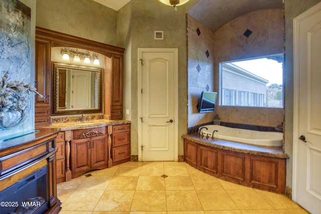 7444 Caldwell Canyon Rd, Snowflake, AZ 85937 - full bath with a garden tub, vanity, tile patterned floors, and vaulted ceiling