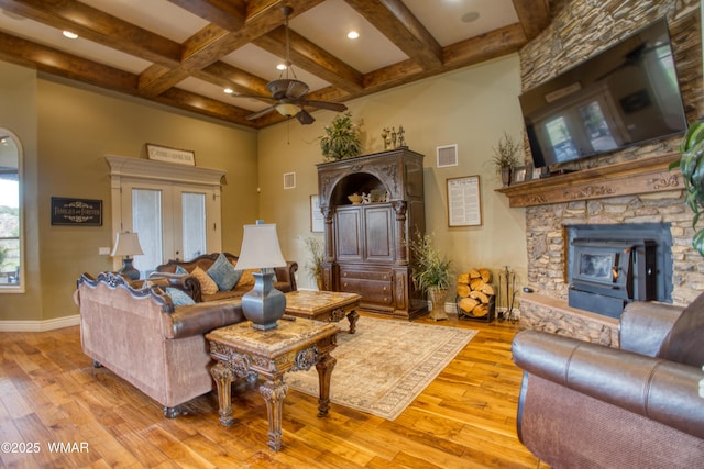 7444 Caldwell Canyon Rd, Snowflake, AZ 85937 - living area featuring ceiling fan, beamed ceiling, light wood-type flooring, coffered ceiling, and baseboards