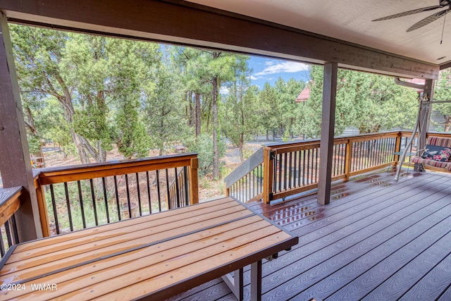 wooden terrace featuring a ceiling fan