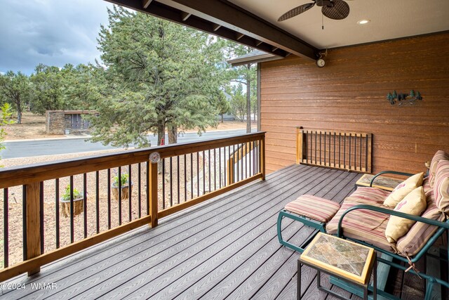 wooden terrace with a ceiling fan