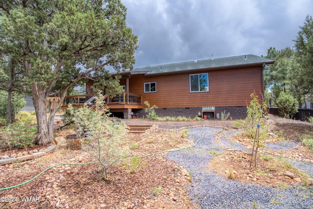 rear view of house with a deck