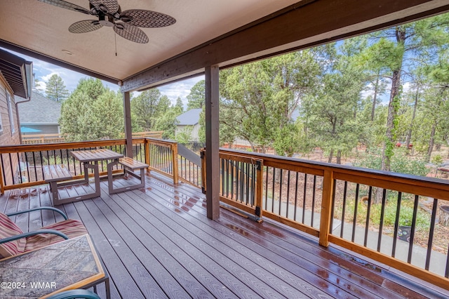 deck with ceiling fan and outdoor dining area