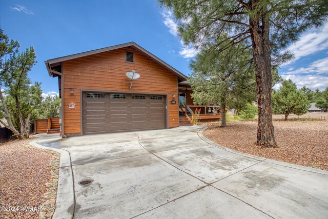 rustic home featuring driveway