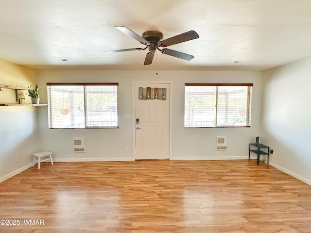 2872 Mustang Trl, Overgaard, AZ 85933 - unfurnished room with light wood-type flooring, heating unit, and ceiling fan