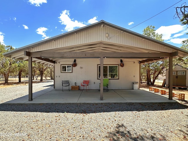 2872 Mustang Trl, Overgaard, AZ 85933 - back of house featuring a patio area and an outdoor structure