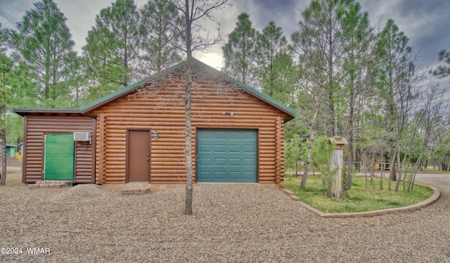 garage featuring a wall mounted air conditioner