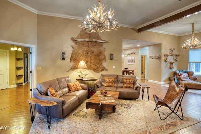 living room with ornamental molding, wood finished floors, and a notable chandelier