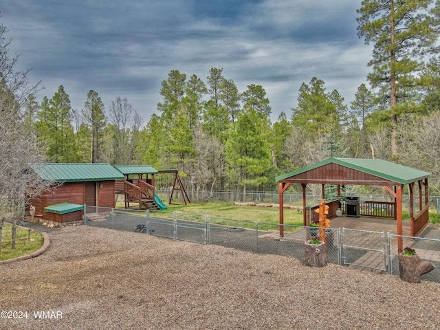 exterior space with a gazebo and fence