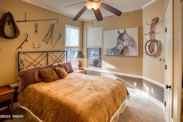 bedroom featuring carpet, baseboards, ornamental molding, and ceiling fan