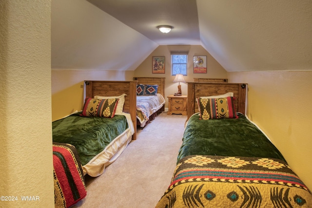 bedroom featuring lofted ceiling and light colored carpet