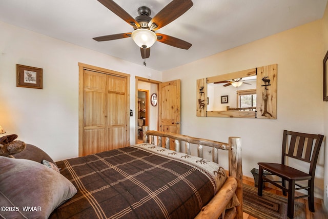 bedroom with ceiling fan and a closet