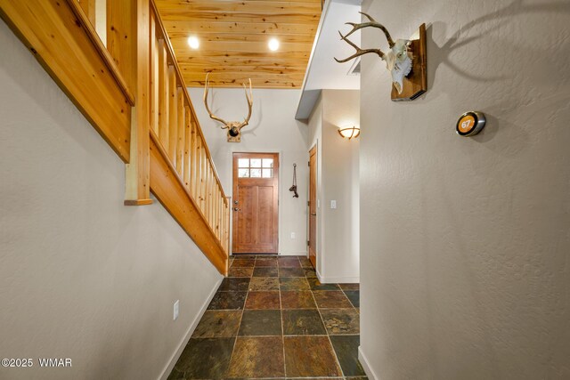 1610 S Canyon Ridge Trl, Show Low, AZ 85901 - doorway with baseboards, stone tile floors, stairway, and wood ceiling
