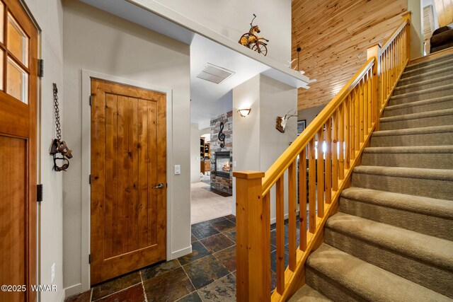 1610 S Canyon Ridge Trl, Show Low, AZ 85901 - entrance foyer with stone tile floors, stairs, and baseboards