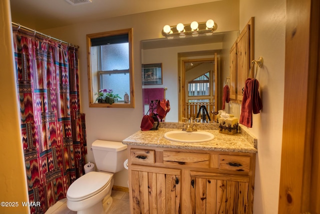 bathroom with tile patterned flooring, toilet, a shower with curtain, and vanity