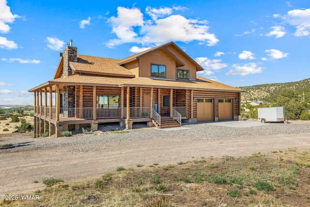 436 E 11th Ln, Eagar, AZ 85925 - log-style house featuring roof with shingles, log exterior, a porch, a chimney, and driveway
