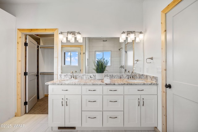 436 E 11th Ln, Eagar, AZ 85925 - full bathroom featuring double vanity, a sink, visible vents, and tiled shower