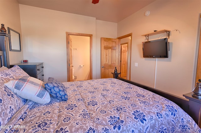 bedroom featuring a ceiling fan and connected bathroom