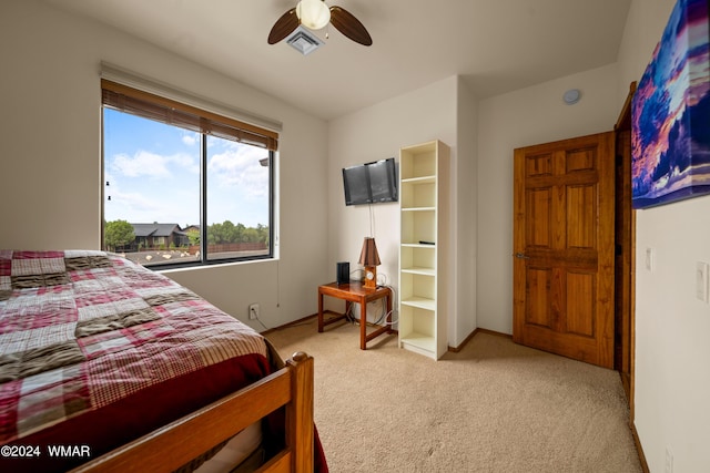 bedroom with baseboards, a ceiling fan, light colored carpet, and visible vents
