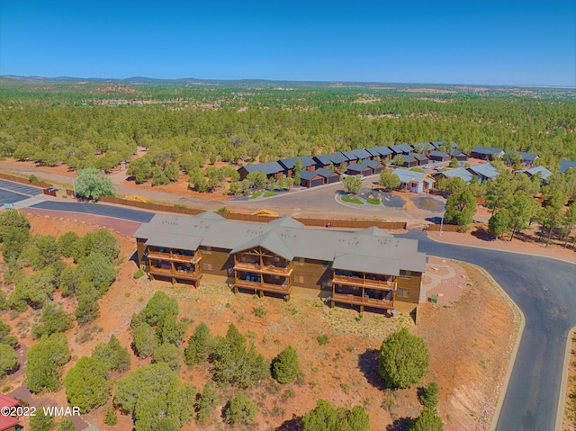 drone / aerial view with a view of trees