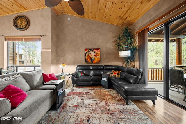 living room with ceiling fan, high vaulted ceiling, light wood-style flooring, and wood ceiling