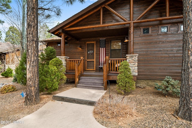 entrance to property featuring a porch