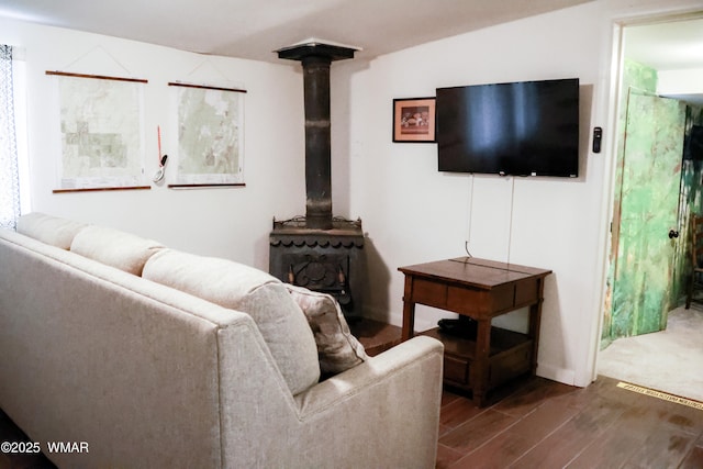 2853 Markham Rd, Overgaard, AZ 85933 - living room with wood finished floors and a wood stove