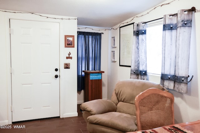 2853 Markham Rd, Overgaard, AZ 85933 - living area with dark wood-style flooring, plenty of natural light, and baseboards