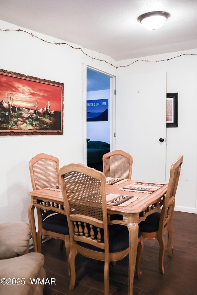 2853 Markham Rd, Overgaard, AZ 85933 - dining area with wood finished floors and baseboards