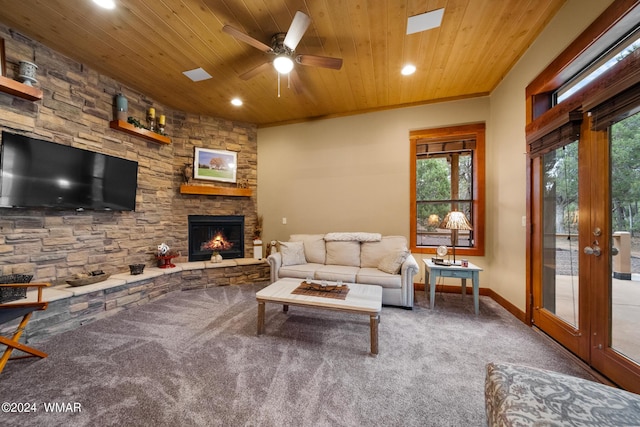 living room featuring carpet floors, a fireplace, recessed lighting, wooden ceiling, and baseboards