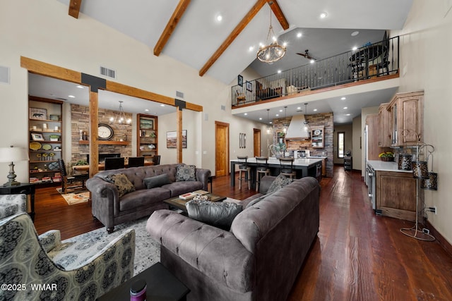 living area featuring a chandelier, high vaulted ceiling, dark wood-style flooring, visible vents, and beam ceiling