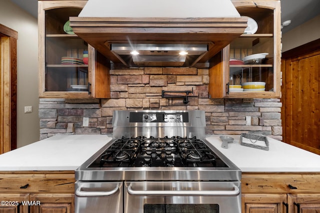 kitchen with light countertops, stainless steel gas stove, and open shelves