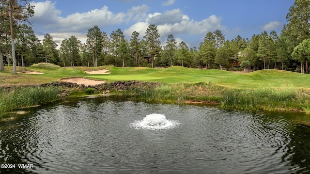 property view of water featuring view of golf course