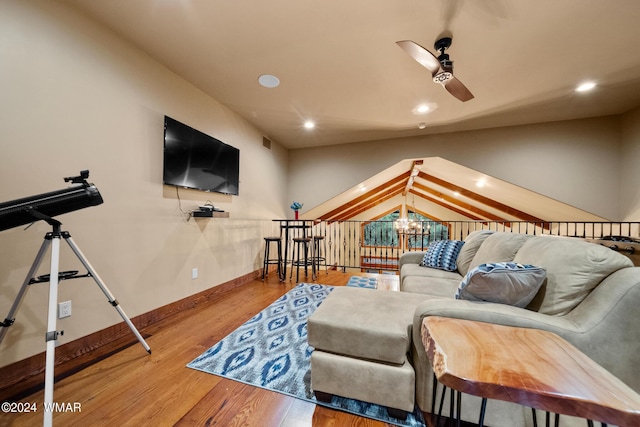 living area featuring recessed lighting, baseboards, wood finished floors, and ceiling fan with notable chandelier