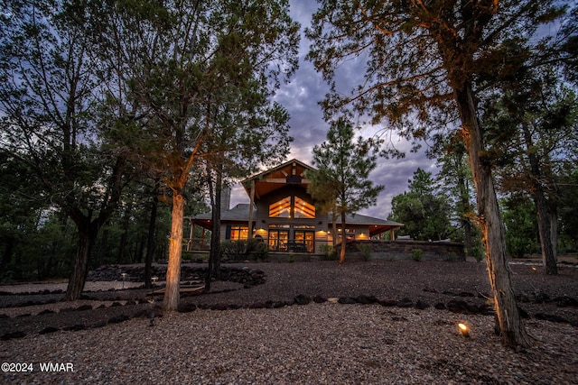 view of back of property at dusk