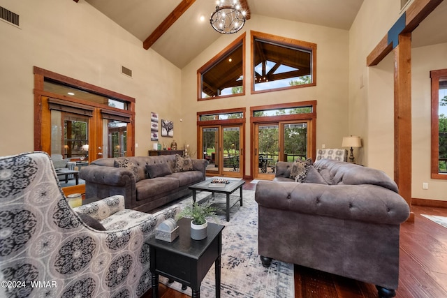 living room featuring french doors, a notable chandelier, visible vents, wood finished floors, and beamed ceiling