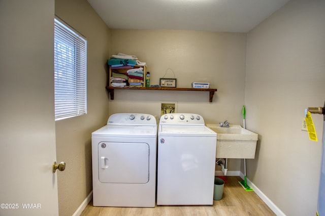 7287 Moon Creek Cir, Pinetop, AZ 85935 - laundry area with washing machine and dryer, light wood-style flooring, and baseboards