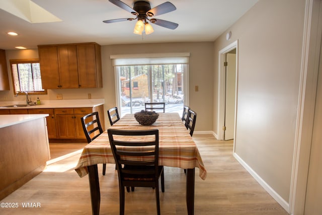 7287 Moon Creek Cir, Pinetop, AZ 85935 - dining space with light wood-type flooring, baseboards, a ceiling fan, and recessed lighting
