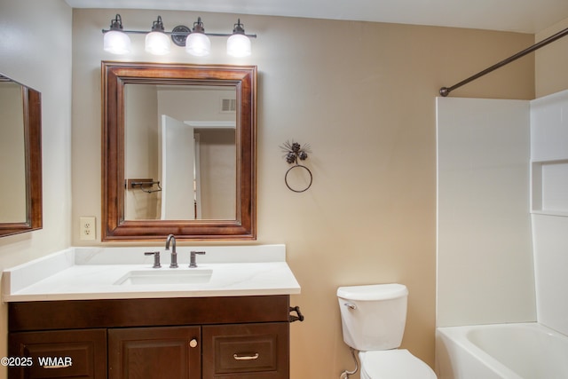 7287 Moon Creek Cir, Pinetop, AZ 85935 - bathroom featuring toilet, vanity, and shower / washtub combination