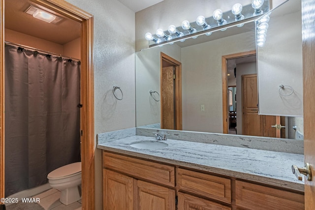 full bath featuring visible vents, toilet, vanity, and tile patterned flooring