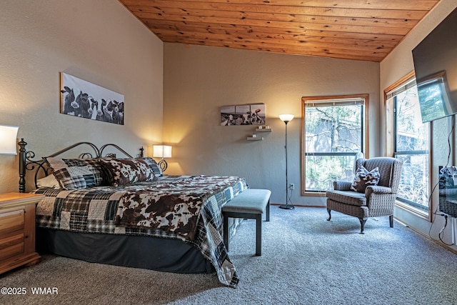 carpeted bedroom with a textured wall, baseboards, vaulted ceiling, and wooden ceiling