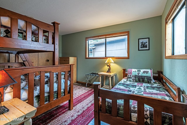 bedroom featuring baseboards