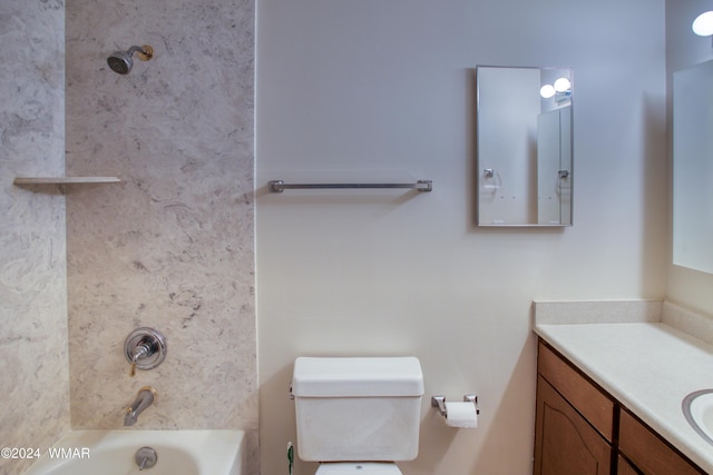 bathroom with toilet, shower / tub combination, and vanity