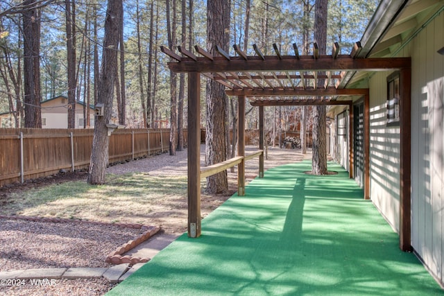 exterior space featuring a fenced backyard and a pergola