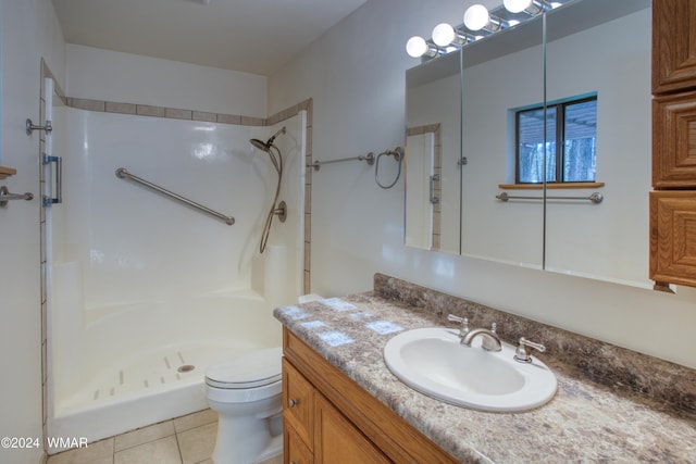 full bath with vanity, a shower stall, toilet, and tile patterned floors